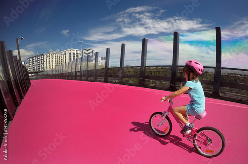Young girl ride a bike
