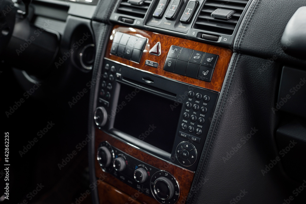 Fototapeta premium Modern car dashboard. Screen multimedia and control buttons.