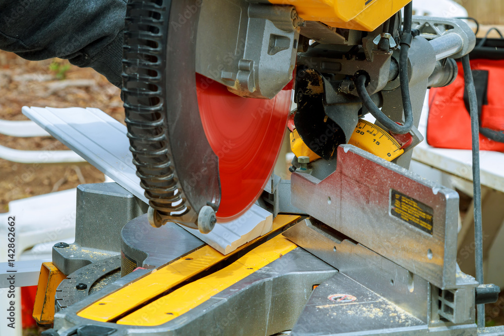 Circular saw cutting wooden plank close-up blade concepts