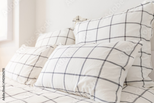 Close - up Stack of white pillow at headboard