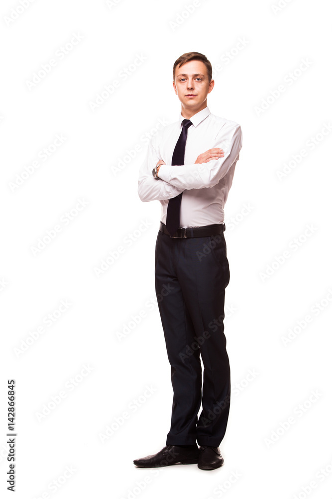 Young handsome businessman is standing crossed hands. portrait isolated on white background Young handsome businessman is standing crossed hands. portrait isolated on white background