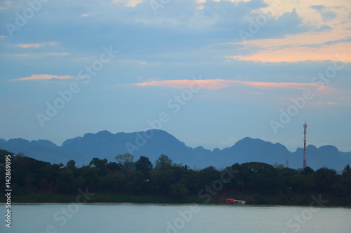 Riverside scenery, sunrise with Mountain at mekong river, khaeng khammouane, Laos : Shot from Nakhon Phanom, Thailand  photo