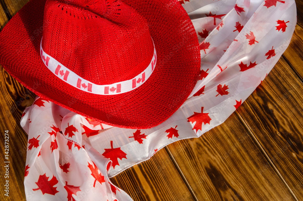 Red Cowboy hat and scarf with maple leaves for Canada Day Stock Photo