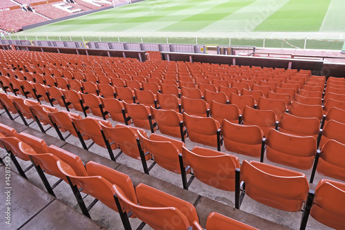 Red seats at football stadium.