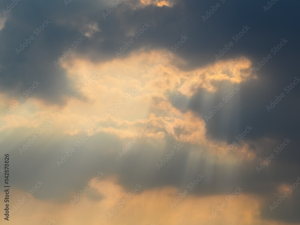 The sun hiding behind the clouds , Used as background