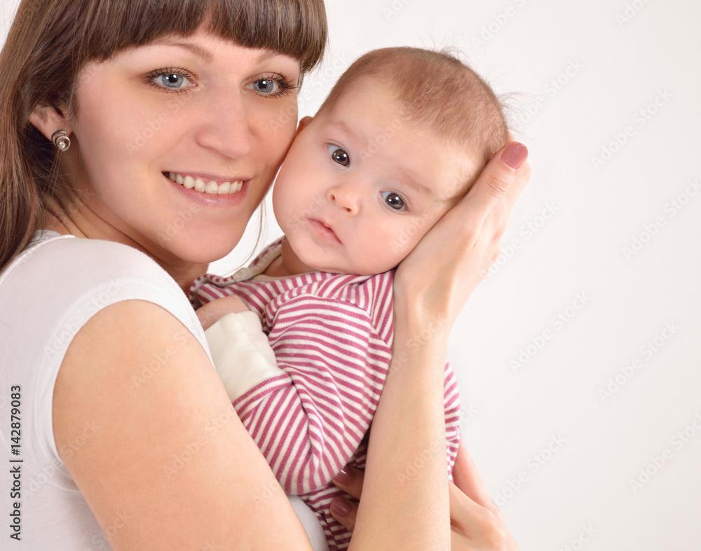 happy mother holds on hands of the newborn baby happy mother holds on hands of the newborn baby