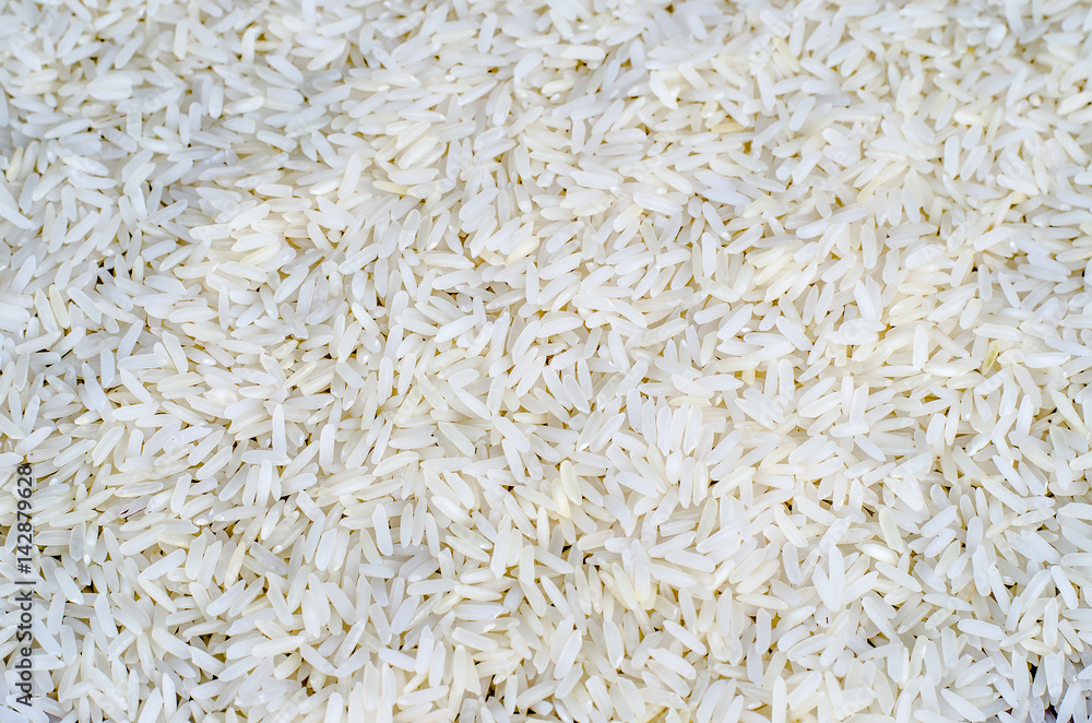 White long rice background, uncooked raw cereals, macro closeup White long rice background, uncooked raw cereals, macro closeup