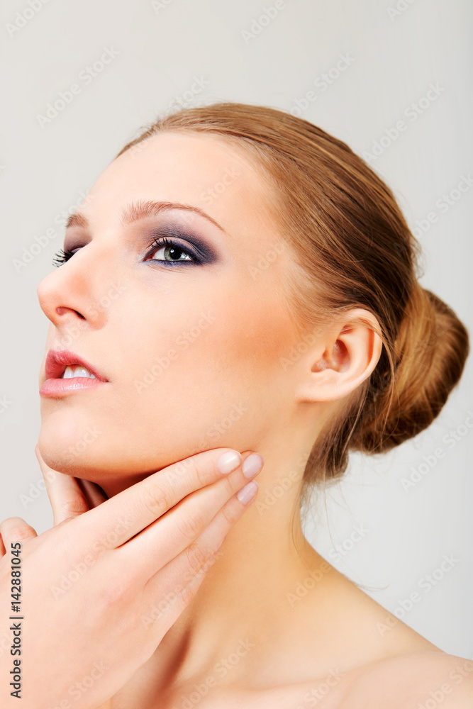 Attractive blonde topless woman with dark eye make up Attractive blonde topless woman with dark eye make up