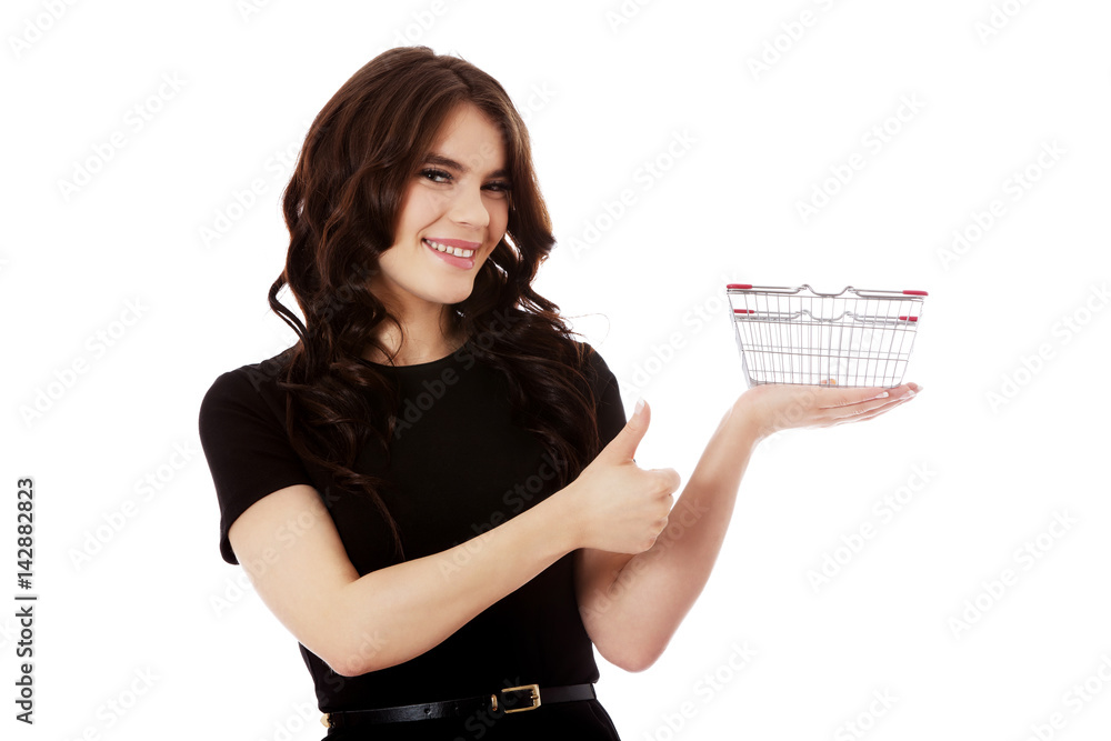 Woman holding mini shopping cart
