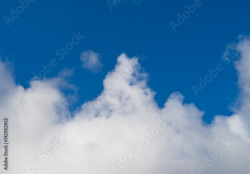 White clouds in the blue sky.