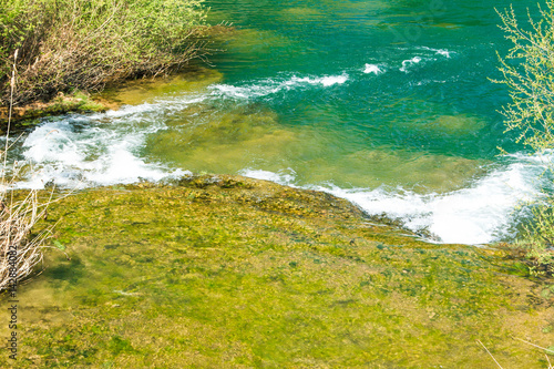  Waterfall and clear green water on Mreznica river in Croatia. Panoramic view. 