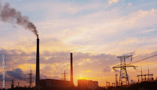 Power station at dusk and power lines