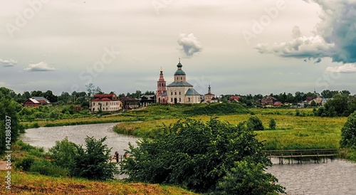 View of Suzdal from the Kamenka river in overcast cloudy weather