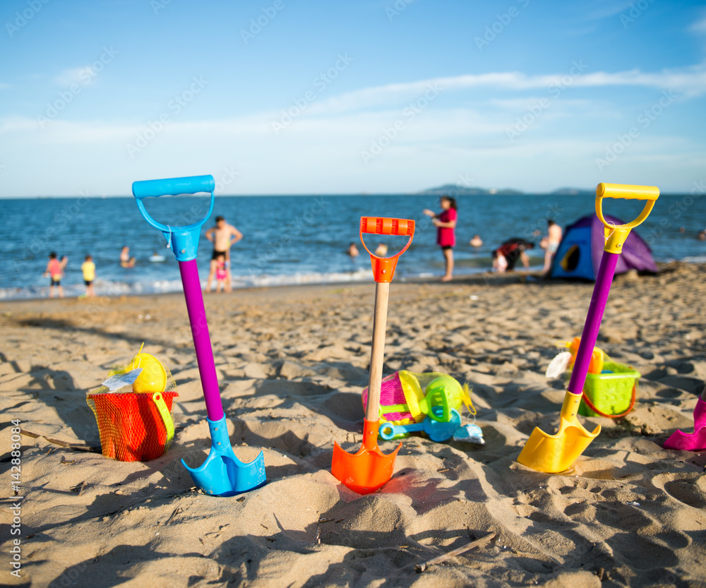 Group of children's beach toys on a sunny day. Group of children's beach toys on a sunny day.