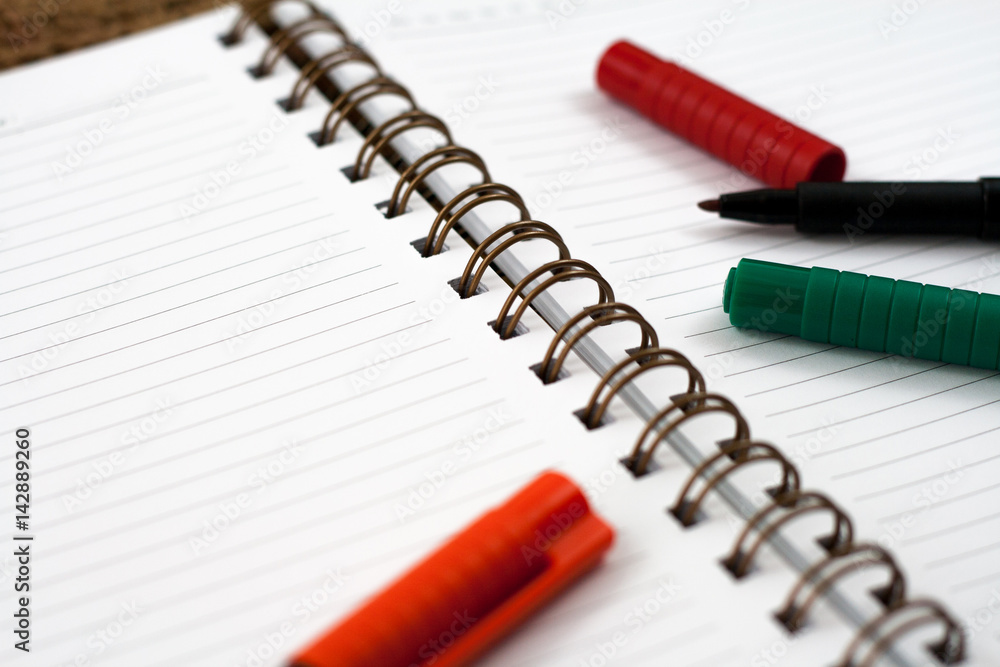 Selective focus, pen on the notebook Selective focus, pen on the notebook