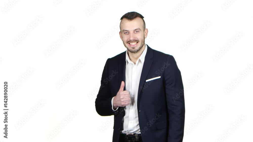 Pleased man shows gesture all right, thumbs up. White background Pleased man shows gesture all right, thumbs up. White background