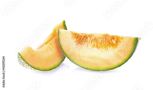 Melon pieces on white background
