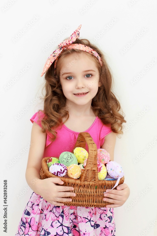Adorable little girl playing with Easter eggs Adorable little girl playing with Easter eggs