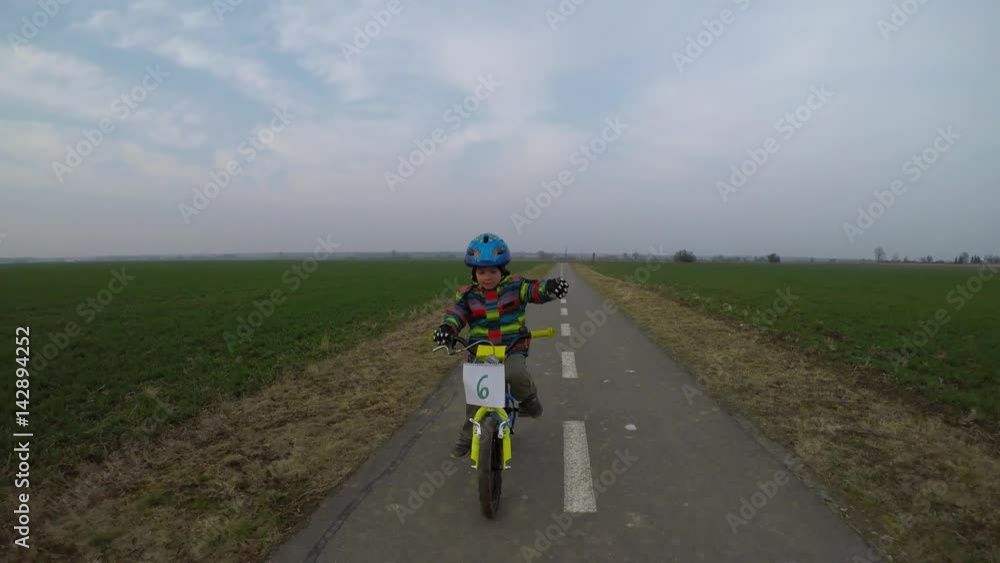 Cute little boy riding a bike.
Boy riding a bike along the cycle path. Cute little boy riding a bike.
Boy riding a bike along the cycle path.