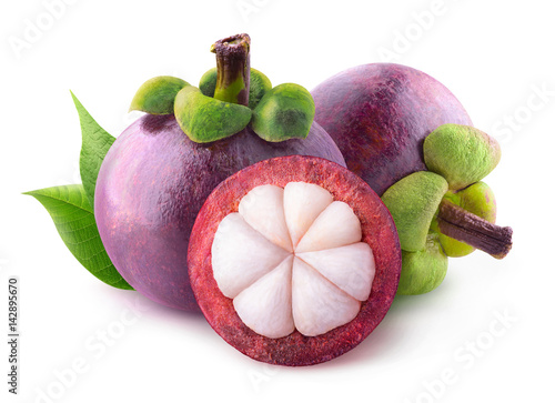 Isolated mangosteens. Two whole fruits and one half isolated on white background with clipping path photo