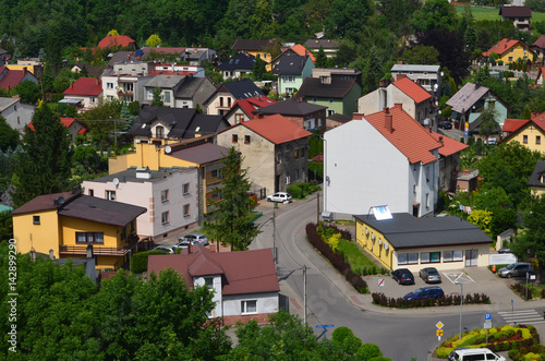 Obraz na płótnie Widok osiedla mieszkaniowego w Oświęcimiu z lotu ptaka w lecie/Aerial view of settlement in Oswiecim town in summer, Lesser Poland, Poland w salonie