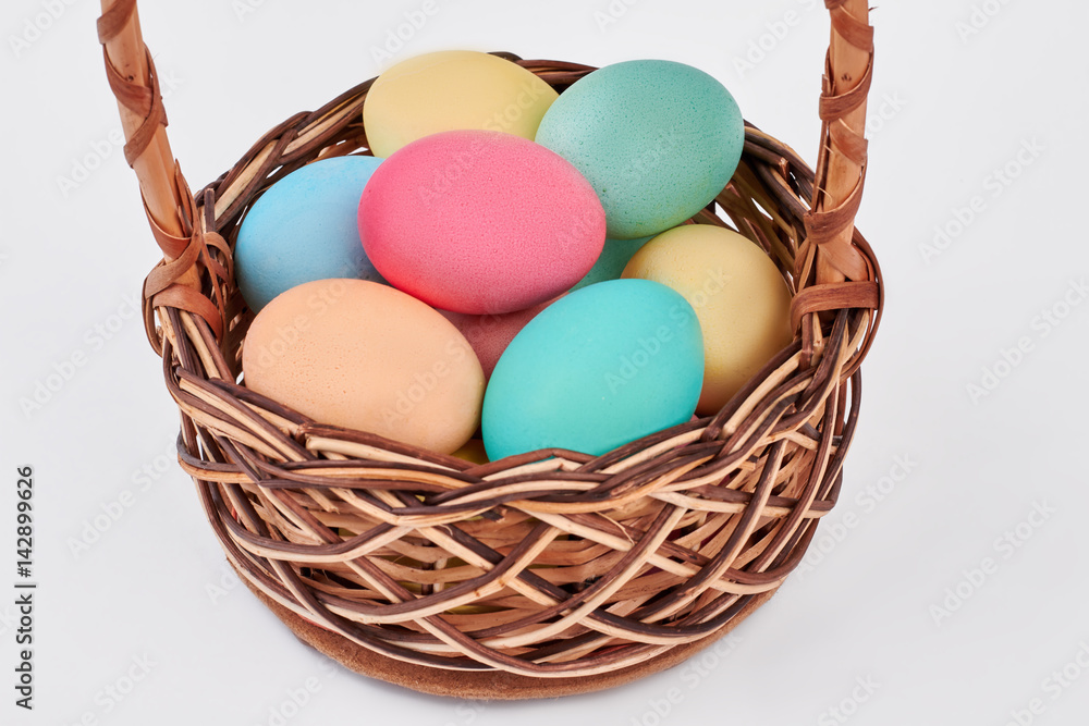 Easter egg basket isolated. Pile of painted chicken eggs. Easter egg basket isolated. Pile of painted chicken eggs.