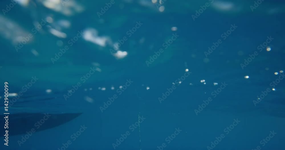 Women jumping off boat into ocean two girls jump into clear blue water from sailboat enjoying active lifestyle summer holiday travel vacation adventure Women jumping off boat into ocean two girls jump into clear blue water from sailboat enjoying active lifestyle summer holiday travel vacation adventure