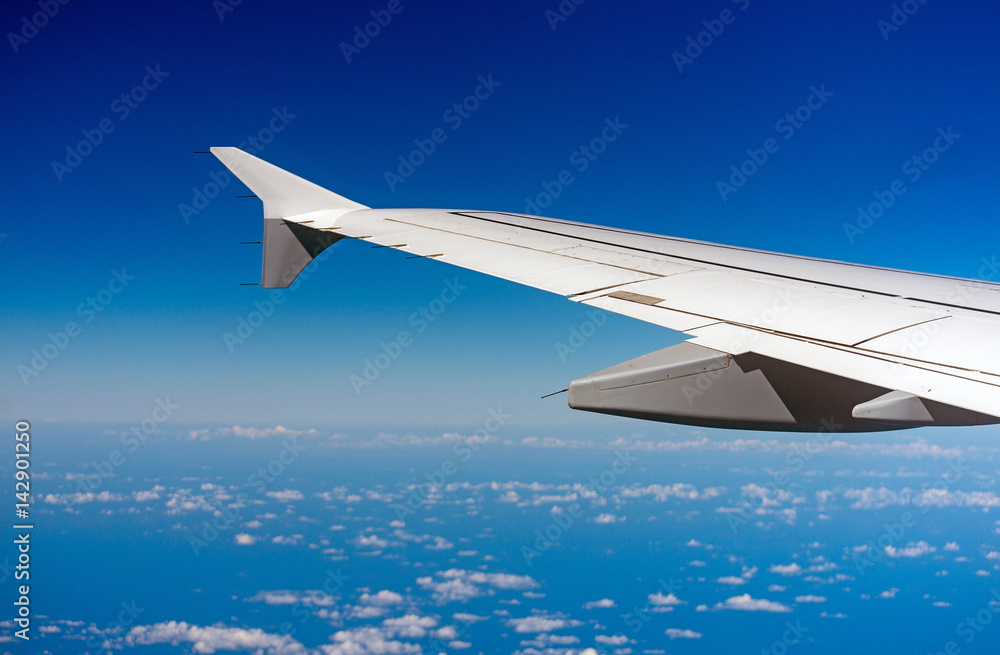 Fototapeta premium Wing of an airplane, view from window.