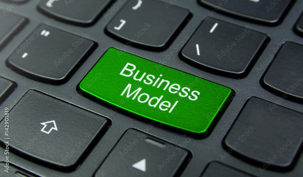 Close-up the Business Model button on the keyboard and have Green color button isolate black keyboard Close-up the Business Model button on the keyboard and have Green color button isolate black keyboard