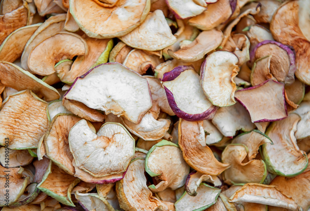 abstract background from pieces of dried apples thinly sliced abstract background from pieces of dried apples thinly sliced
