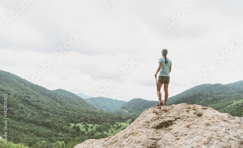 Female explorer walking in the mountains