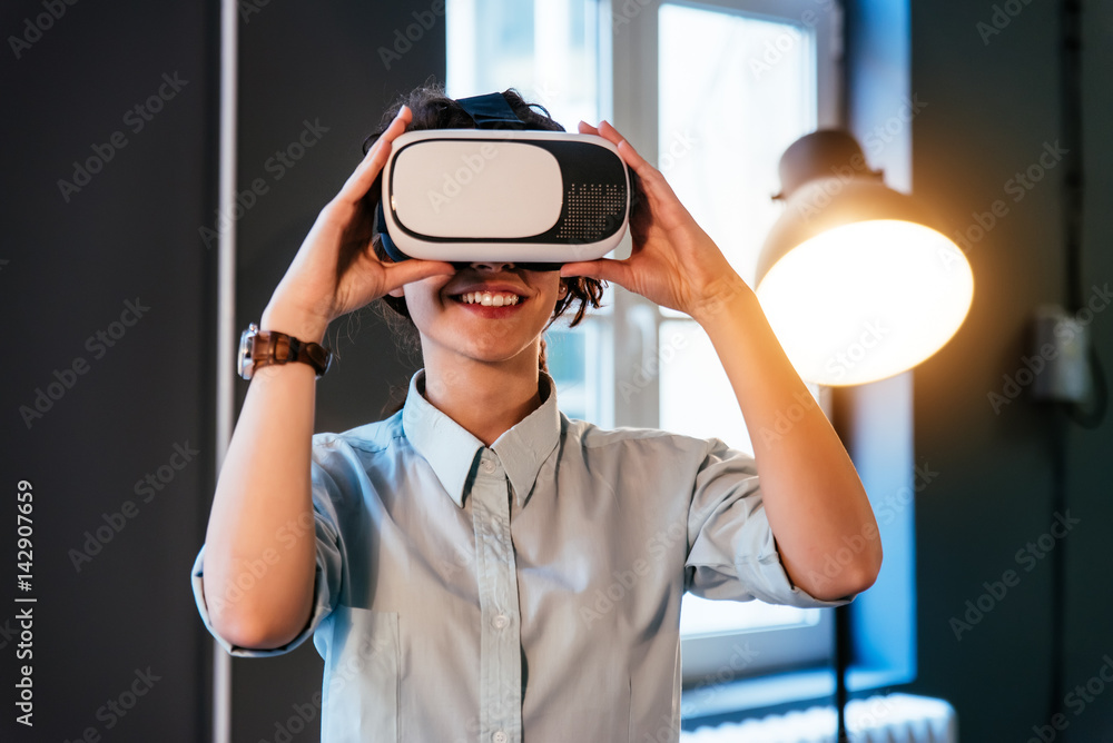 Young creative girl using VR glasses at home Young creative girl using VR glasses at home