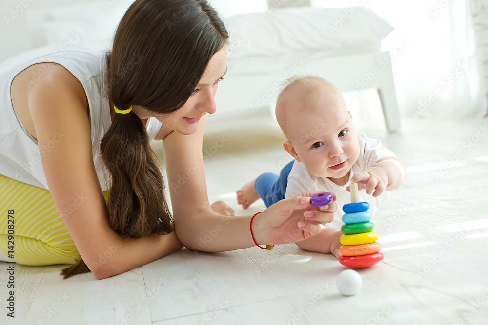 Mom plays with the baby Mom plays with the baby