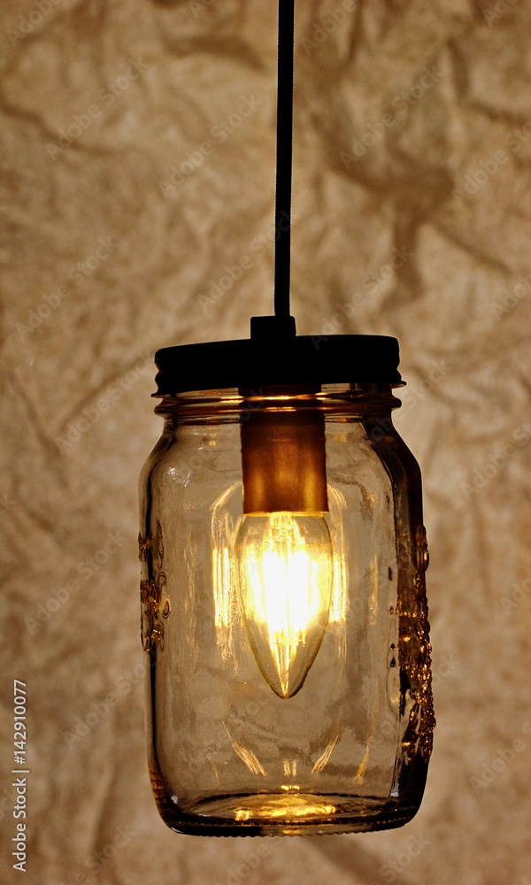 Vintage style pendant lights on dark grunge background.