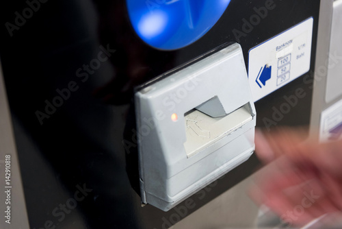Canvas Print Crop of hands buys a ticket vending machine, Asian tourist buys a ticket for train at vending machine