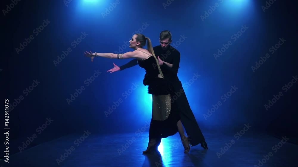 Jive dancing pair of professional dancers in slow motion, smoke Jive dancing pair of professional dancers in slow motion, smoke