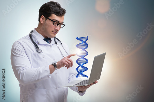 Young studentresearcher studying dna structure photo