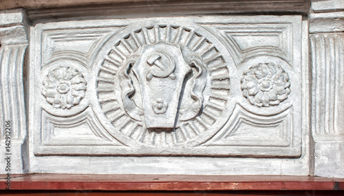 bas-relief with a hammer and sickle of the ussr photo