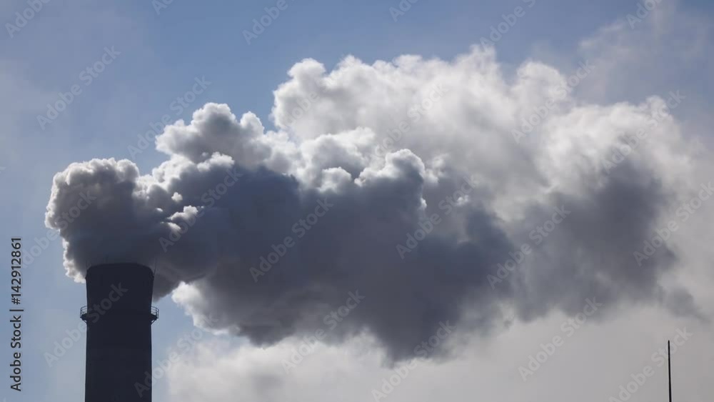 Working pipe in industrial factory from which smog comes out Working pipe in industrial factory from which smog comes out
