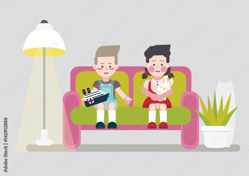twins sitting on sofa. cozy home twins sitting on sofa. cozy home