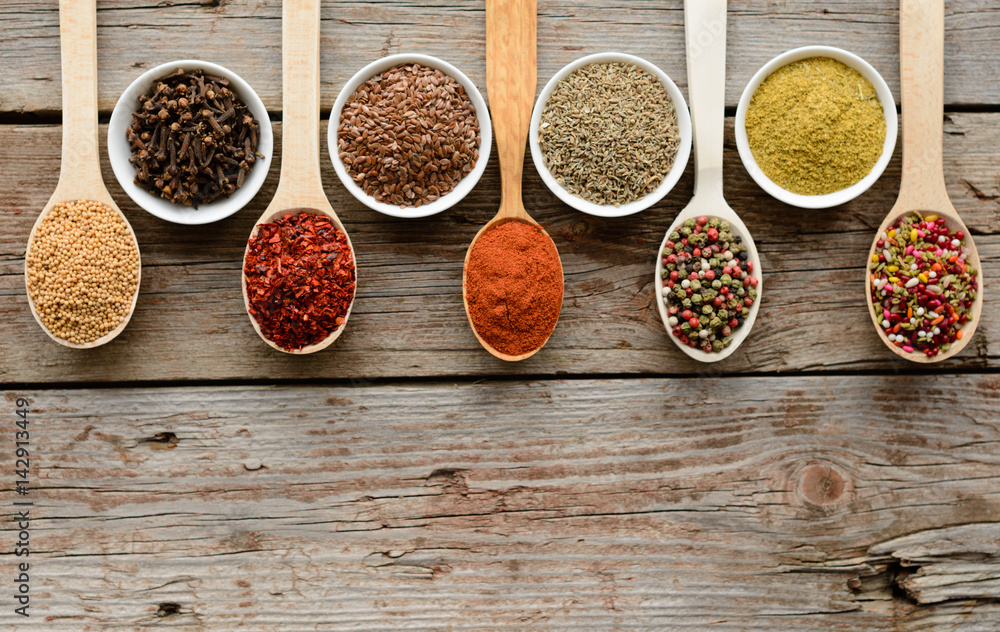 Various spices on wooden spoons. Food ingredients Various spices on wooden spoons. Food ingredients