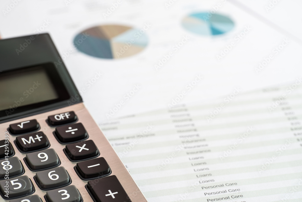 Close up of calculator and documents of personal budget.Financial Management concept.(Selective focus) Close up of calculator and documents of personal budget.Financial Management concept.(Selective focus)