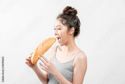 woman eat fresh fragrant bread.