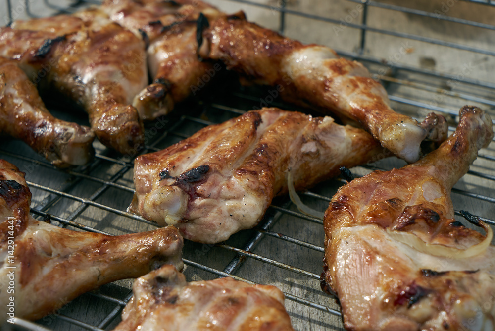 Close-up of Barbecue with Delicious grilled chicken meat on charcoal fire, outdoor grill.Weekend concept.