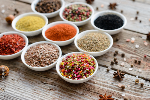 Various spices on wooden spoons. Food ingredients