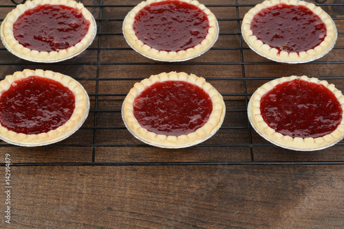 strawberry tarts cooling on rack