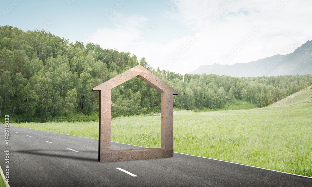 Conceptual background image of concrete home sign on asphalt road Conceptual background image of concrete home sign on asphalt road