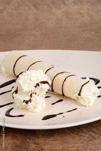 vanilla ice cream crepe with chocolate sauce photo