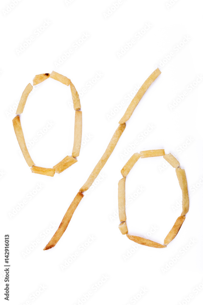 Fototapeta premium Symbol percent sign laid with french fries. Alphabet letter food