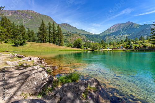 Small alpine lake among mountains.
